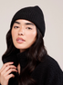 The Knit Beanie in Black, front portrait