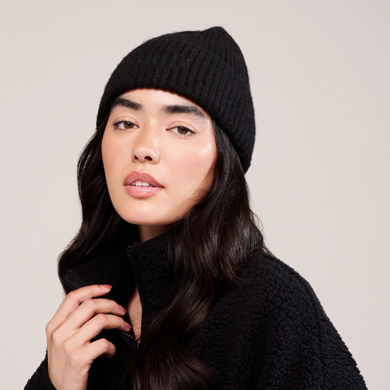 The Knit Beanie in Black, front portrait